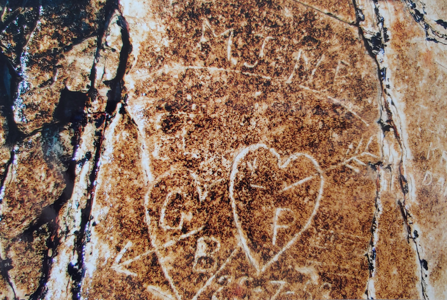 Initials George carved into rock at Brantevik are pictured.